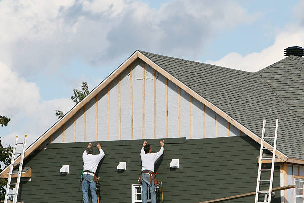 Professional Siding technician working in Cameron, TX